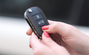 a lady with a new car key