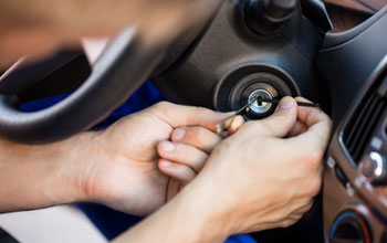 a vehicle locksmith extracting a snapped key from iginition barrel